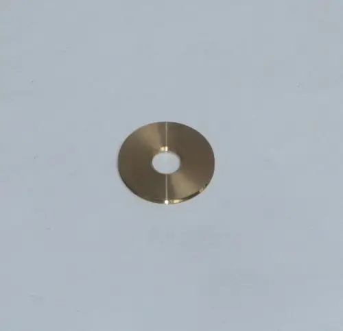 Scheibenförmiger, glänzender Metallteil mit zentralem Loch, geeignet für die Verwendung in Gasflussanwendungen, möglicherweise kompatibel mit Daikin-Produkten.